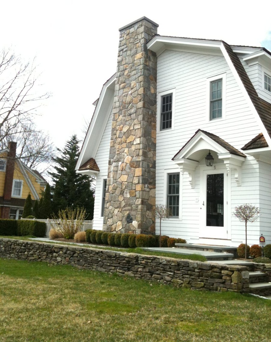 Stone chimney in a modern-themed house.